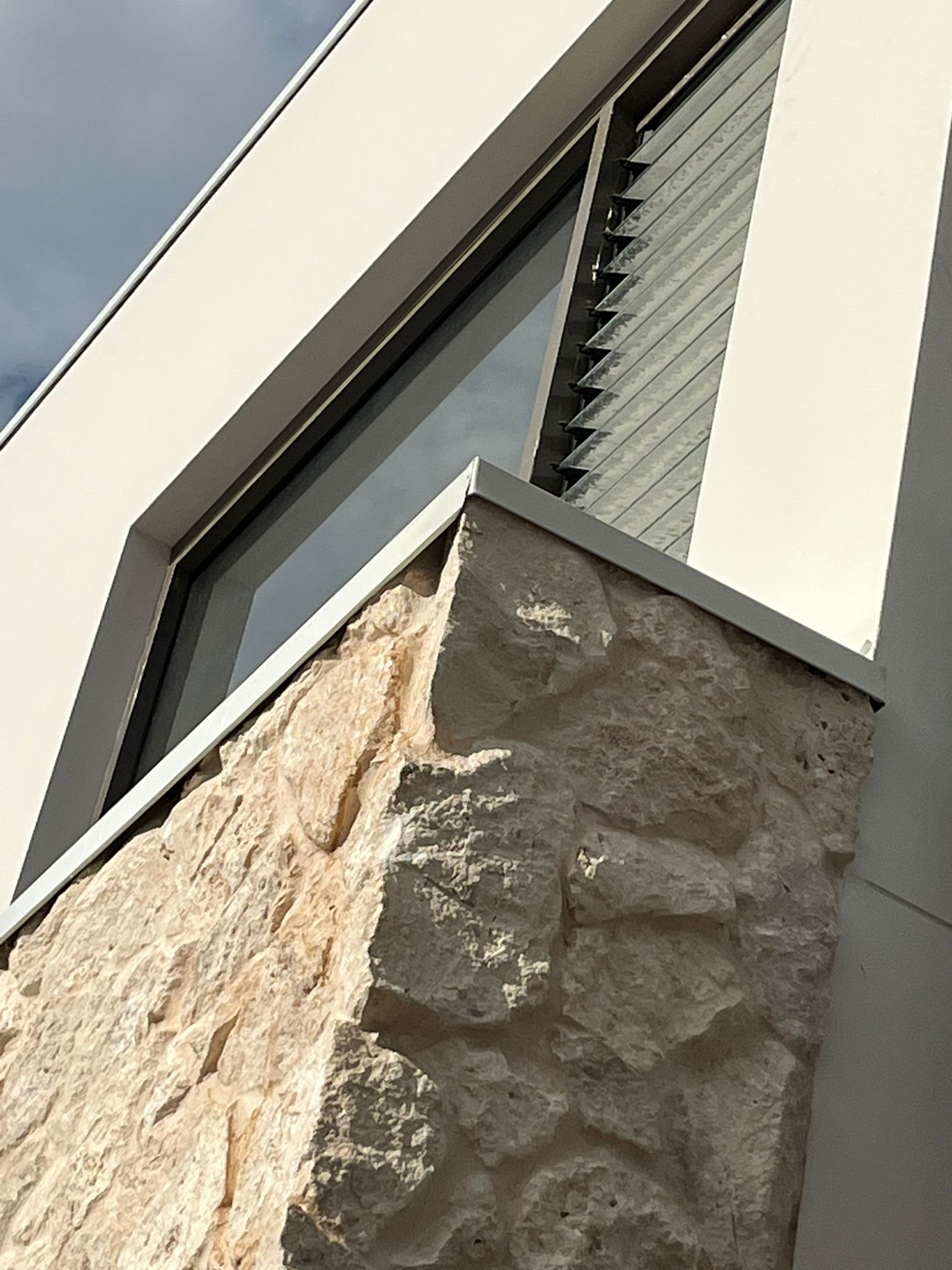 Premium stone cladding and louvre window detail